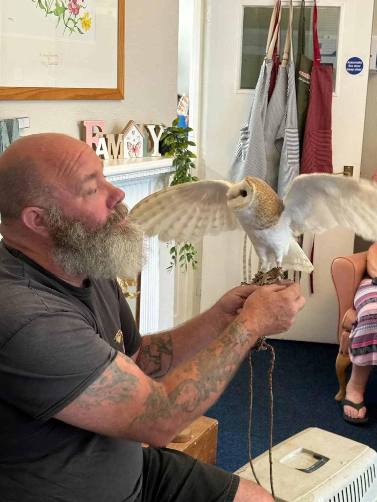 A resident looking closely at a visiting owl during the Martham Lodge owl visit.